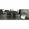 An office setting with desks, chairs, and a white space heater. Produktbild-Vorschau