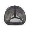 The back view of a black mesh trucker hat with a camouflage pattern underneath. Podgląd zdjęcia produktu