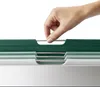 A hand is shown selecting a cutting board from a set of stacked cutting boards. Anteprima dell’immagine prodotto