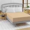 A bed with a fitted sheet and pillows, in a bedroom setting. Produktbild-Vorschau