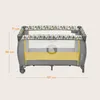 A baby travel cot with dimensions indicated by measurement lines and text. Podgląd zdjęcia produktu