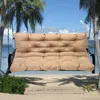 A swing cushion on a beach with palm trees and the ocean in the background. Náhled obrázku produktu