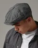 A man wearing a herringbone cap. Náhled obrázku produktu