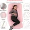 A pregnant woman is lying on a pink U-shaped pregnancy pillow, with diagrams illustrating the benefits of the pillow. Anteprima dell’immagine prodotto