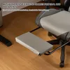 Close-up of a gray and black ergonomic gaming chair with its footrest extended, sitting on a wooden floor. Anteprima dell’immagine prodotto