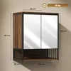 A wall-mounted bathroom cabinet with mirrored doors and an open shelf below, shown against a neutral wall. Produktbild-Vorschau