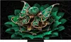 A decorative, ornate object resembling a flower or butterfly with green and gold elements, displayed on a black background. Produktbild-Vorschau