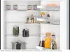 Inside of a Siemens refrigerator with various food items and drinks on shelves. Produktbild-Vorschau