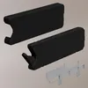 A product shot of three parts of a cabinet hinge mechanism against a neutral background. Anteprima dell’immagine prodotto