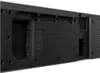 A close-up view of the back panel of a black soundbar, showing various ports and connections. Podgląd zdjęcia produktu