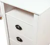 A close-up view of a white wooden desk with three drawers and black handles. Podgląd zdjęcia produktu