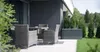 An outdoor patio area with furniture and a storage box. Podgląd zdjęcia produktu