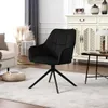 A black velvet armchair is shown in a living room setting, next to a sofa and a cabinet. Produktbild-Vorschau
