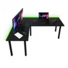 A black L-shaped gaming desk with a monitor, laptop, keyboard, mouse, and controller, illuminated by green LED lights. Produktbild-Vorschau