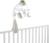 A baby mobile attached to the side of a crib. Podgląd zdjęcia produktu