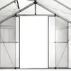 Interior view of a greenhouse with a large open doorway. Produktbild-Vorschau