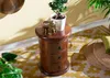 A wooden nightstand with drawers, decorated with a golden elephant figurine and a potted plant, placed on a patterned rug. Voir les images du produit