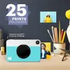 A Kodak Printomatic camera is displayed on a desk with various art supplies and photos. Anteprima dell’immagine prodotto