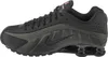 A side view of a black Nike Shox R4 sneaker. Produktbild-Vorschau