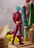 A figurine of Ban from The Seven Deadly Sins is displayed on a wooden surface with fruits and bottles in the background. Produktbild-Vorschau