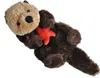 A plush toy sea otter lying on its back, holding a red starfish. Anteprima dell’immagine prodotto