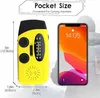 A yellow and black hand-crank radio is shown next to a smartphone, with dimensions indicated by measurement lines. Produktbild-Vorschau