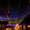A street decorated with colorful net lights at night. Náhled obrázku produktu