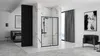 A modern bedroom and bathroom suite with a shower enclosure, bed, and seating area. Produktbild-Vorschau