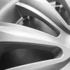 A close-up, black and white shot of a car wheel rim. Produktbild-Vorschau