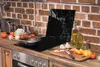 A kitchen counter with a stovetop, cutting board, and various ingredients. Náhľad obrázku produktu