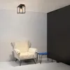 A minimalist room corner with a chair, a small table, and a ceiling light. Náhľad obrázku produktu