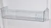 A close-up view of an empty clear plastic shelf inside a refrigerator. Produktbild-Vorschau
