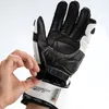 A hand is shown adjusting a black and white motorcycle glove. Podgląd zdjęcia produktu
