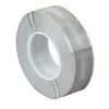 A roll of clear tape with gray stripes on a white background. Produktbild-Vorschau