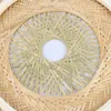 A close-up view of a woven bamboo lamp shade, showing the intricate pattern of the material. Náhled obrázku produktu