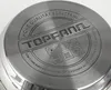The bottom of a stainless steel pot with embossed text and symbols. Produktbild-Vorschau