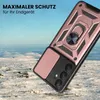 A rose gold phone case with a ring holder is shown in a snowy, outdoor environment. Produktbild-Vorschau