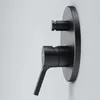 A black shower faucet is mounted on a light gray wall. Produktbild-Vorschau