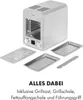 A silver high-temperature grill with various accessories laid out in front of it, on a white background. Produktbild-Vorschau