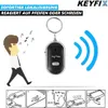 A person whistling to activate a key finder, with instructional diagrams below. Produktbild-Vorschau