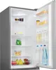The inside of an open refrigerator, showing shelves stocked with various food and drink items. Podgląd zdjęcia produktu