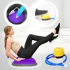 A woman is using a purple balance trainer while a foot pump and close-up views of the product's inflation mechanism are shown. Náhled obrázku produktu