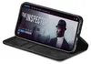 A black flip cover phone case is shown holding an iPhone displaying a movie poster. Produktbild-Vorschau