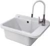 A white sink with a chrome faucet and a white flexible hose, with water running. Anteprima dell’immagine prodotto