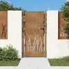 A corten steel garden gate with a grass design, set between white brick pillars and surrounded by greenery. Produktbild-Vorschau