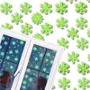 A child looks out a window decorated with glowing green snowflake stickers. Podgląd zdjęcia produktu