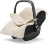 A baby car seat with a knitted cover and liner. Anteprima dell’immagine prodotto