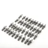 A collection of small, pointed metal spikes arranged in rows on a white background. Produktbild-Vorschau