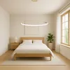 A bedroom with a bed, nightstand, and a window. Anteprima dell’immagine prodotto