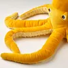 A close-up shot of a yellow plush octopus toy. Anteprima dell’immagine prodotto